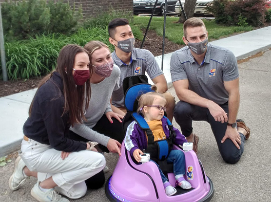 Design Team with Amira in the Toddler Powerchair